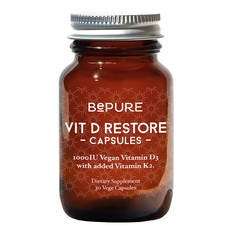 Image of a brown bottle with a title be pure vit D restore capsules 1000IU Vegan Vitamin D3 with added Vitamin K2 Dietary supplement 30 vege Capsules