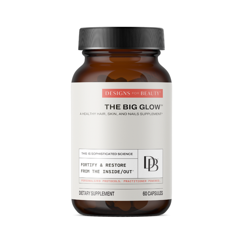 A supplement container of The Big Glow by Designs for Beauty