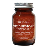 Image of a brown bottle with a title be pure vit D restore capsules 1000IU Vegan Vitamin D3 with added Vitamin K2 Dietary supplement 30 vege Capsules 