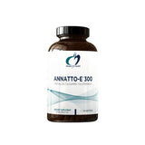 A white supplement bottle which says designs for health Annatto E 300 300mg delta/gamma tocotrienols dietary supplement 30 softgels 